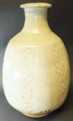 A Phil Rogers vase, ash glazed with hatched or latticework panelled decoration, 44.