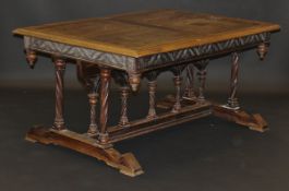 A 19th Century French Gothic style oak dining table, the top with moulded edge above a tracery