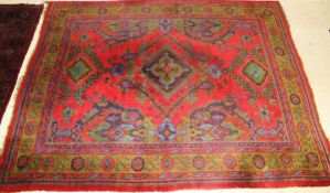 A Caucasian carpet, the central diamond shaped medallion in green, turquoise,