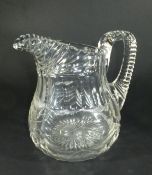 A circa 1800 cut glass jug with horizontal ribbed lip and handle, cut neck and swagged body, 18.