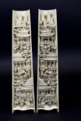 A pair of 19th Century Chinese carved ivory wrist rests representative of day and night, one