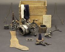 A boxed "Auto-Knitter" ribber knitting machine or sock knitting machine, circa 1913, together with