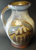 A David Eeles jug of baluster form decorated with moonlit snow capped mountain scene within a