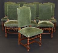 A set of eight circa 1900 walnut framed and upholstered high back chairs in the circa 1700 manner,