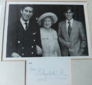 A framed and glazed colour image of the Queen Mother in Royal carriage with Princes Andrew and