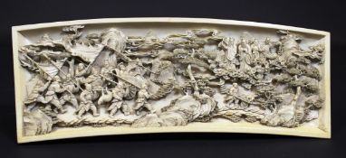 A 19th Century Japanese Meiji period carved ivory panel of slightly curved form depicting a