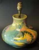 A Moorcroft squat baluster shaped table lamp decorated in the "Koi Carp" pattern, bearing