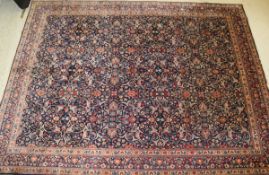 A Persian carpet, the centrefield with all-over stylised floral and foliate decoration in