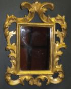 A pair of 19th Century Florentine style acanthus decorated wall mirrors of small proportions