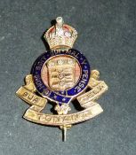 A 9 carat gold and enamel decorated Royal Artillery pin set with small diamonds, 3 cm x 2.3 cm, 6.