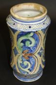 A late 18th Century Sicilian Maiolica albarello of simple waisted form with foliate decorated