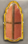 An early 19th Century wall mirror in the Venetian style with gilded border and cut glass studwork