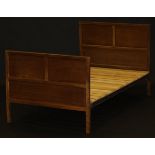A circa 1950 walnut bedstead by Fred Gardiner (Provenance: Believed by the family to have been made