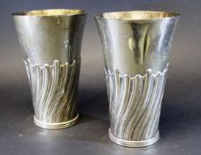 A pair of Victorian silver trumpet shaped vases with wrythen embossed decoration (by Susannah