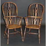 Two 19th Century Windsor type stick back armchairs in ash and elm, the fretwork carved back splats
