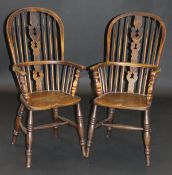 Two 19th Century Windsor type stick back armchairs in ash and elm, the fretwork carved back splats