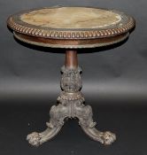 A Regency rosewood centre table by Gillows of Lancaster, the circular top with beaded edge, brass
