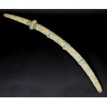 A 19th Century Japanese carved ivory cased katana, the handle and scabbard decorated with figural