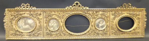 A 19th Century carved giltwood and gesso decorated five section picture frame CONDITION REPORTS
