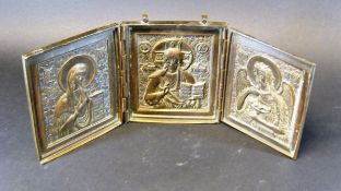A 19th Century Russian triptich travelling icon, the three panels depicting the Virgin Mary,