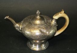 A William IV silver inverted pear shaped coffee pot with engraved decoration,