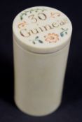 A 19th Century carved ivory cylindrical guinea case with screw on lid inscribed "30 guineas", 6.