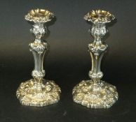 A pair of candlesticks in the Rococo taste (by Fenton Brothers Limited, Sheffield, 1923), 22.