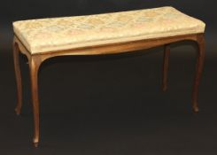 A Victorian rosewood framed dressing stool with upholstered top on cabriole legs,