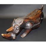 An African carved wooden figure of a rhinoceros,
