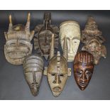 Seven various African wooden masks including a Fang mask decorated with white pigment,