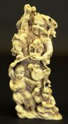 A 19th Century Japanese Meiji period carved ivory okimono depicting a rat catcher with child helper