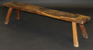 A 19th Century oak pig bench on four splayed supports,
