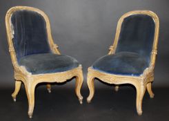 A pair 19th Century carved giltwood and gesso framed salon chairs in the Louis XV taste,
