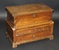 A 19th Century Welsh oak and pine coffer bach with rising lid over two short and one long drawer