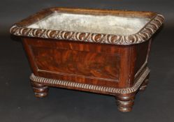 An early Victorian mahogany wine cooler with egg and dart rim over a tapered main body on beaded