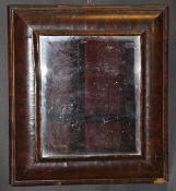 A circa 1700 oyster walnut veneered cushion framed wall mirror with bevel edged plate, 63 cm x 70 cm