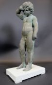 A bronze figure of a crying putto, raised on painted wooden base,