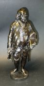 A 19th Century patinated bronze figure of Benjamin Franklin with a tri-corn hat in his left hand,