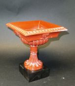 A Torre Rosso marble effect tazza, raised on a modern ebony stand, 17.5 cm wide at top CONDITION