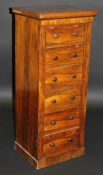 A Victorian rosewood Wellington chest of six drawers with double locking mechanism, raised on a