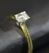 An 18 carat gold mounted solitaire diamond ring, the rectangular cut stone approx 0.