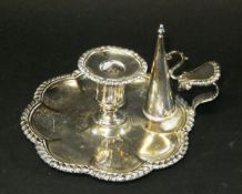 A George IV silver chamberstick with associated snuffer (by John and Thomas Settle, Sheffield,