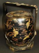 A 20th Century Chinese hokai and carrier with black lacquered background and decorated with hooded