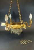 An early 20th Century gilt metal and glass hanging ceiling light of three branches with feathered