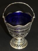 A Victorian silver pierced sugar basket with blue glass liner (by William Pope, London, 1873), 13 cm