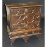 A 17th Century oak chest on stand,