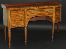 A late Regency mahogany sideboard with galleried back over a rosewood strung top with single bow