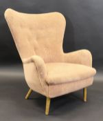 An Ernest Race (1913-1964) DA1 wing chair in pale peach upholstery, on beech legs CONDITION