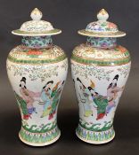 A pair of late 19th Century Chinese polychrome decorated vases of baluster form,