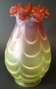 A cranberry and vaseline glass oil lamp shade with swagged decoration,